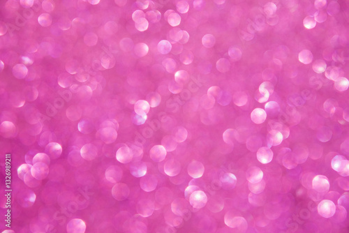 A soft pink bokeh-style background with unfocused light creates an elegant space for text or design elements.