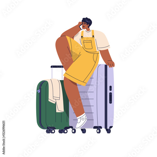 Tourist sitting on suitcase, speaking on phone. Happy passenger talking on sm...