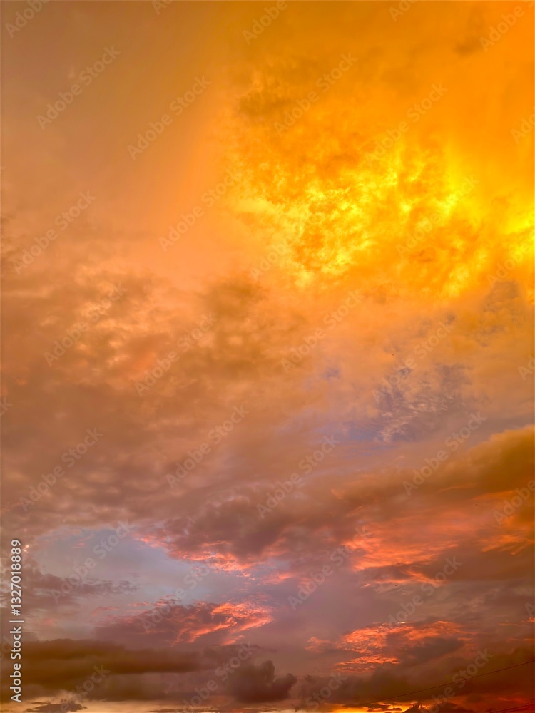 Fototapeta premium Beautiful sky with natural gradations. Thick clouds in the dusk sky on a winter night. Image of a cloudy sky in the afternoon. View of the night sky with golden light from the evening sun 