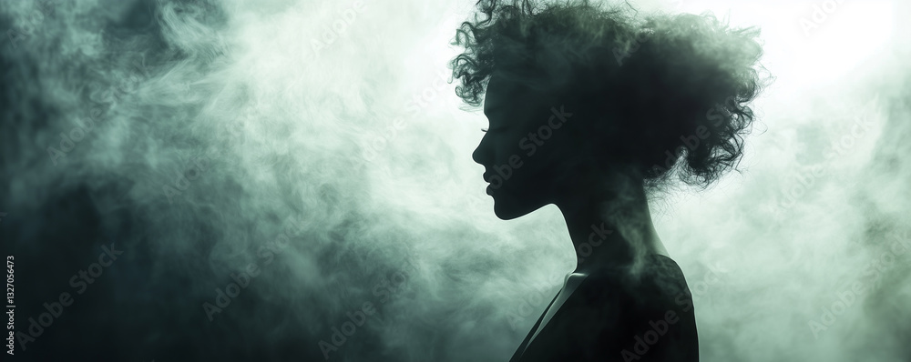 Womans silhouette emerges gracefully from soft cloud of mist during evening glow Womans silhouette emerges gracefully from soft cloud of mist during evening glow