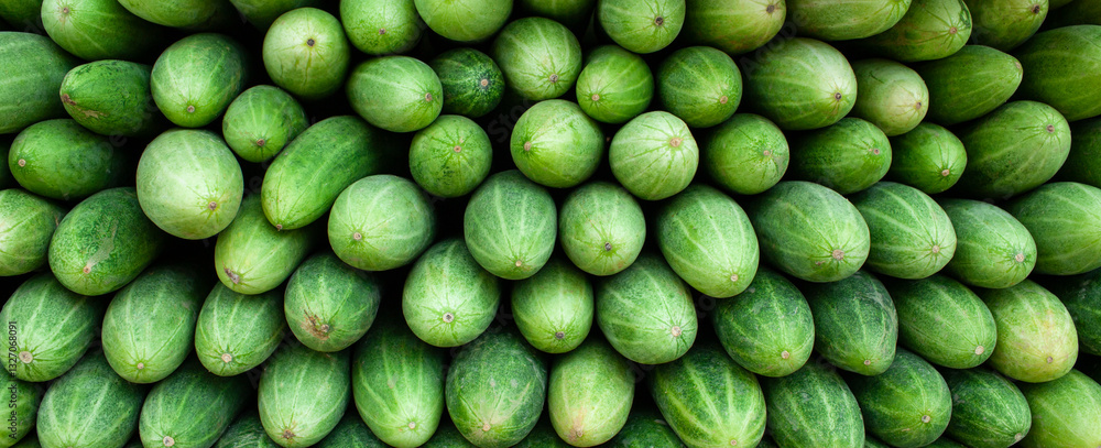 Closeup fresh cucumber background, healthy diet food, banner style Closeup fresh cucumber background, healthy diet food, banner style