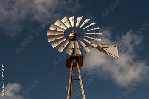 Antiguo Molino de viento en hierro para bombear el agua. Fuerteventura, La Oliva.  photo