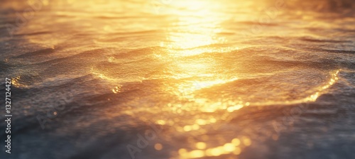 A wet sand texture on a beach at sunset, with reflective surfaces and gentle waves creating a serene, peaceful environment.