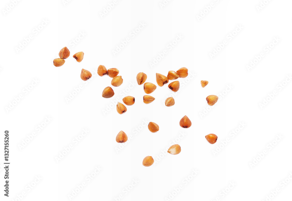 Buckwheat grain isolated on white background close up. Buckwheat grain isolated on white background close up.