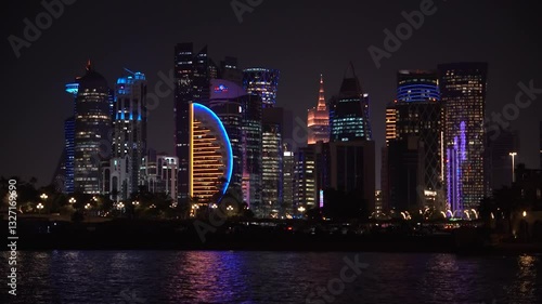 Panoramic night view of West Bay in Doha city. modern skyscrapers can be seen from the corniche