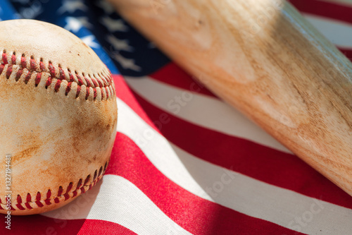 Canvas Print Close up of worn baseball and wooden bat on American Flag