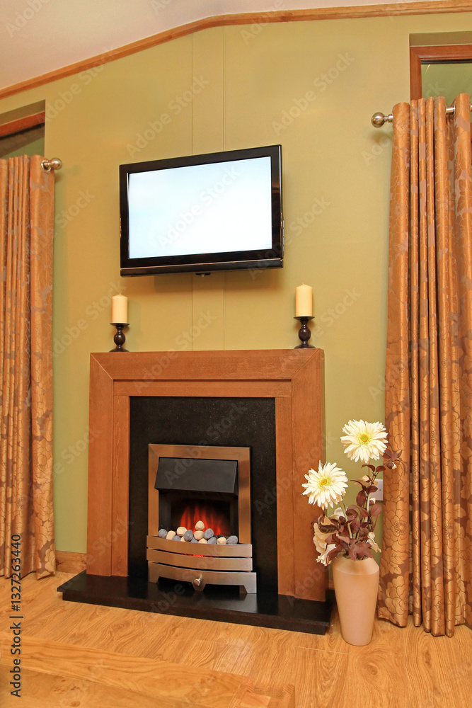 Artificial Fire in Electric Fireplace With Lava Stones and Big Lcd TV Screen at Wall