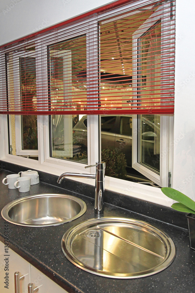 Stainless Steel Double Round Kitchen Sink Silver Faucet at Black Counter Top in Modern Kitchen