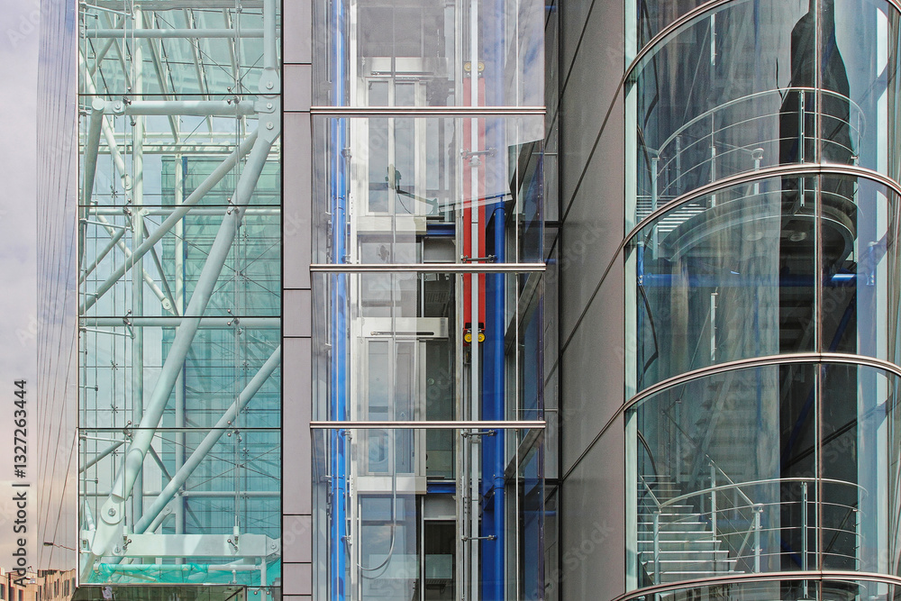 Modern Building With Glass Lift Shaft and Stairway Structure
