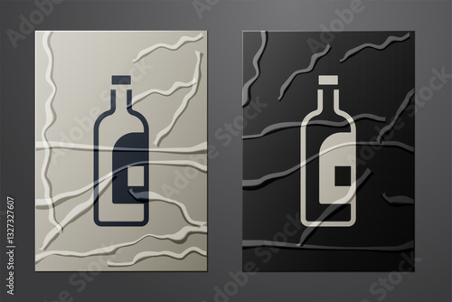 White Bottle of wine icon isolated on crumpled paper background. Paper art style. Vector