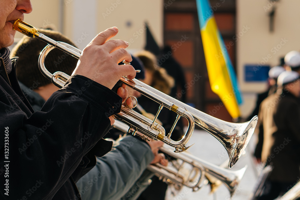 Obraz premium Talented musicians perform an elegant outdoor brass concert, playing French horns with skill and passion, creating a mesmerizing symphony of golden melodies.