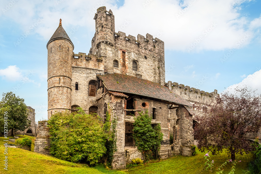 External view of the medieval stone walls of the Castle of the Counts (Gravensteen) in Ghent, Belgium External view of the medieval stone walls of the Castle of the Counts (Gravensteen) in Ghent, Belgium