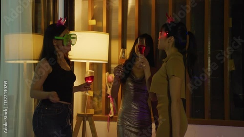 Asian teen friends celebrating a birthday party .	
