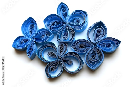 Paper blue quilled flowers on a white background