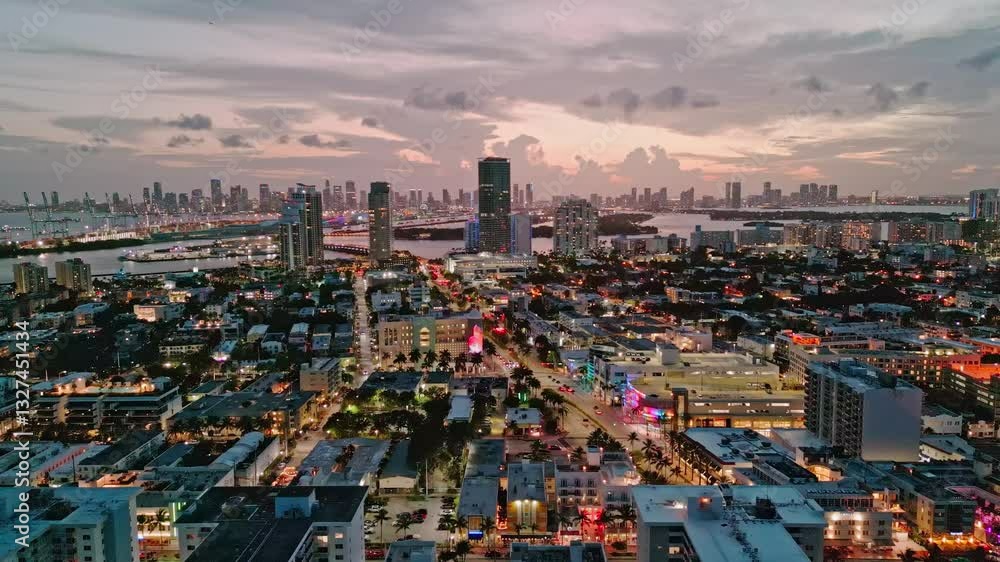 Miami Beach, South Beach at night with dramatic sky. Miami seaside at dusk. Aerial view of evening Miami Beach and cityscape. Coastline of Miami Beach night shot from the air drone. Miami Beach, South Beach at night with dramatic sky. Miami seaside at dusk. Aerial view of evening Miami Beach and cityscape. Coastline of Miami Beach night shot from the air drone.