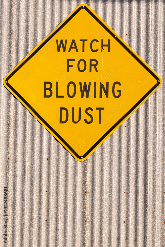 Sign saying 'Watch of Blowing Dust.'