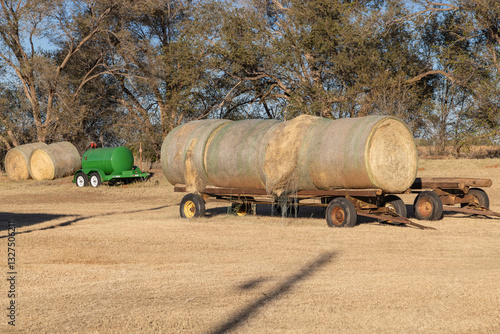 Obraz na płótnie Round hay bales on a trailer. w salonie