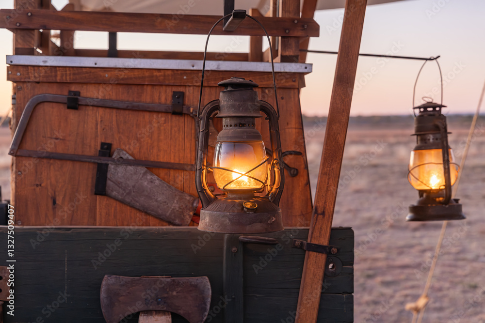 Kerosene lanterns hanging on an old chuck wagon.