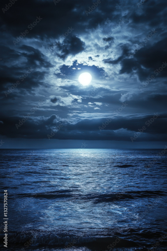 Fototapeta premium A mesmerizing moonlit ocean scene with the full moon glowing softly through a cloudy night sky, casting a serene reflection over the gently rippling waves.