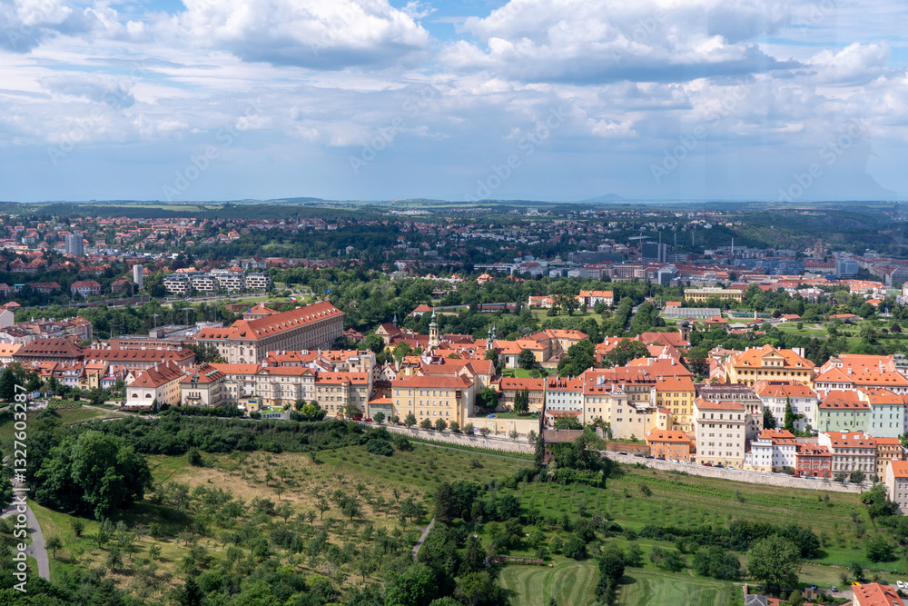 Panoramic view of Prague with the Vltava River, historic bridges, and red rooftops, surrounded by lush greenery. Stunning European cityscape showcasing Czech Republic’s architectural and natural beaut Panoramic view of Prague with the Vltava River, historic bridges, and red rooftops, surrounded by lush greenery. Stunning European cityscape showcasing Czech Republic’s architectural and natural beaut