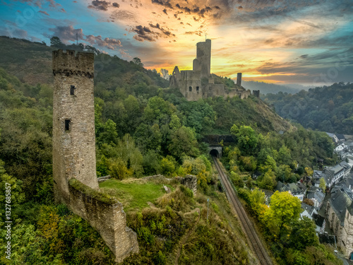 Obraz na płótnie Aerial view of twin castles Philippsburg and Löwenburg above Monreal in Germany with tall keep sunset sky w salonie