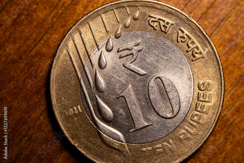 Wallpaper Mural A macro shot of an Indian 10 Rupee bimetallic coin commemorating the 75th year of independence. The coin features the national flag and inscriptions in Hindi and English. Torontodigital.ca