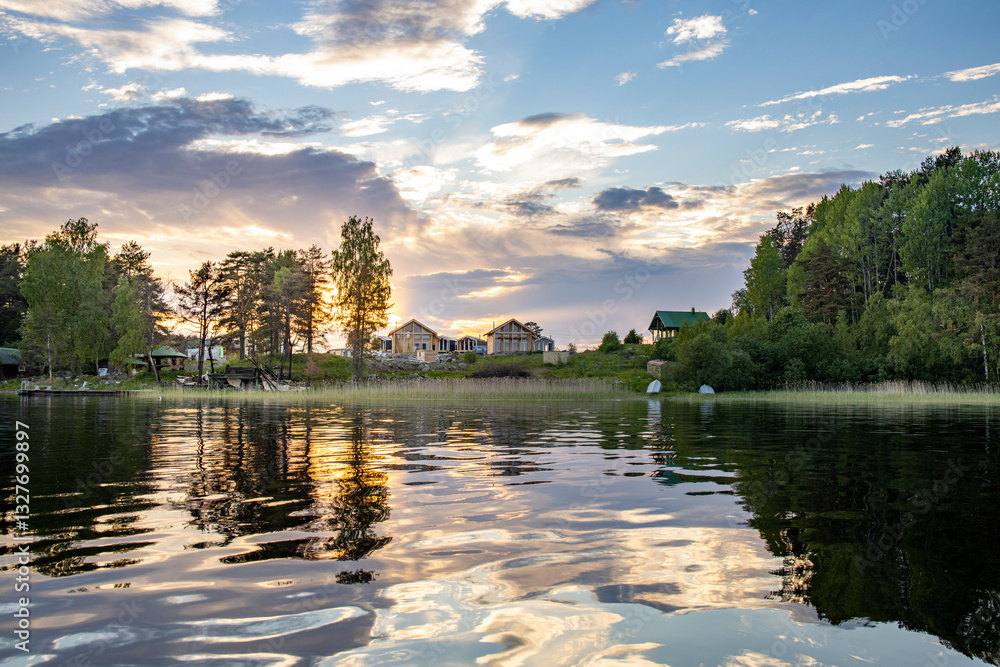 Fototapeta premium A lake with a sunset in the background