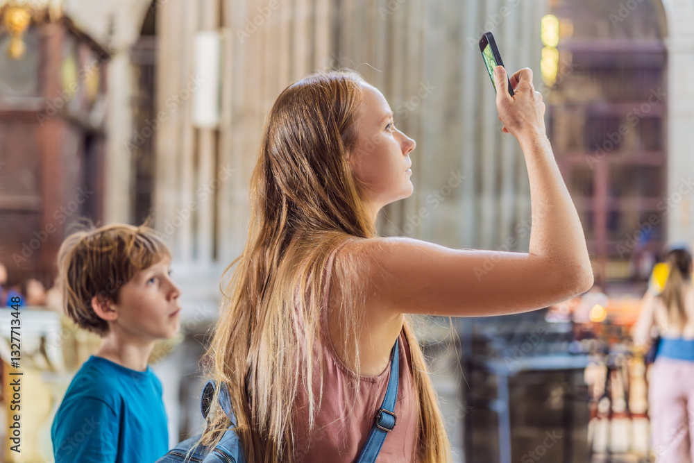 A woman and her son tourists exploring the Metropolitan Cathedral in Mexico City. Woman admiring the architecture and history of Mexico's iconic landmark. Concept of cultural heritage, religious