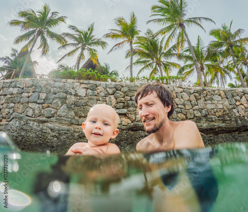 Obraz na płótnie Toddler and father joyfully swimming in the turquoise Caribbean Sea. Family bonding, seaside fun, and tropical vacation concept w salonie