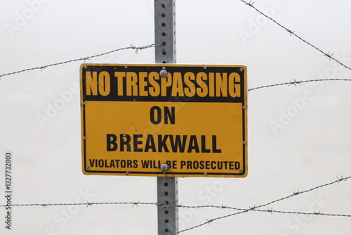 No trespassing on break wall sign 
