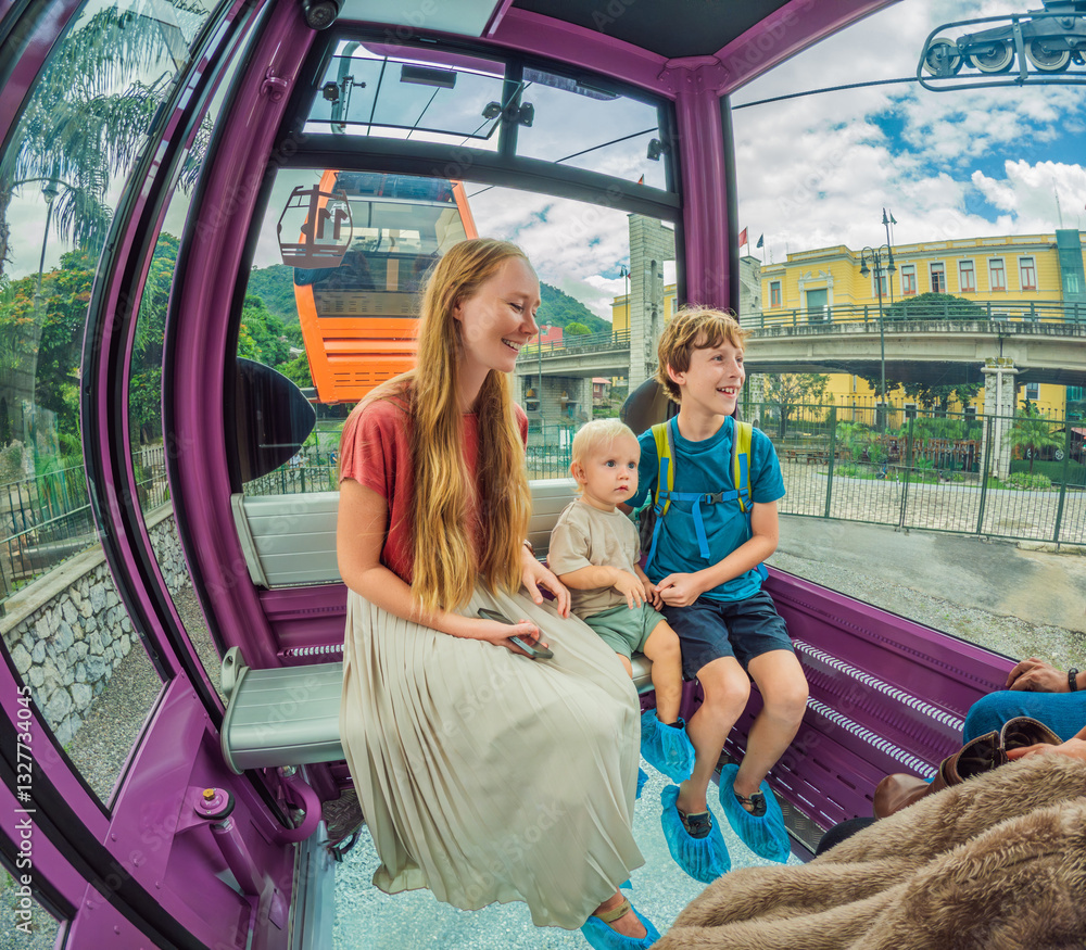 Mother and two sons on a cable car ride in Orizaba, Mexico. Scenic family adventure with panoramic views of the city, lush mountains, and iconic landscapes. Concept of family bonding, travel, and
