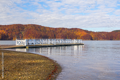 autumn landscape with lake and bridge