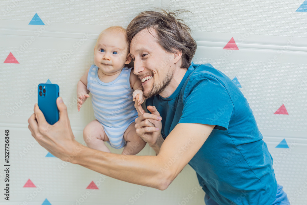 A 3-month-old baby lies safely in a cozy infant cocoon, secured with a special safety belt, while their father lies beside them during a video call. Modern parenting, bonding, and technology concept
