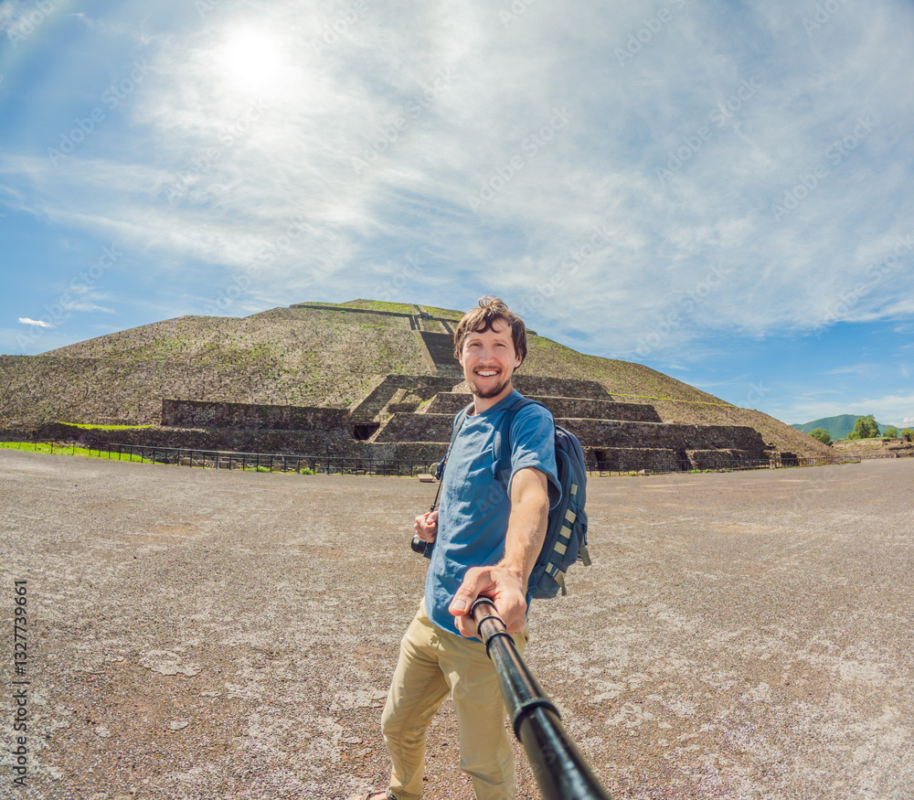 Male tourist exploring Teotihuacan, Mexico. Solo traveler walking through ancient pyramids and ruins at sunrise. Concept of cultural heritage, archaeology, and Mexican tourism