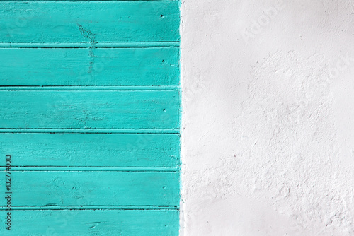 View of a fragment of a wall, covered with boards and half plastered. Horizontal boards and plaster, flat layout. Colourful fantasy in the combination of boards and plaster.