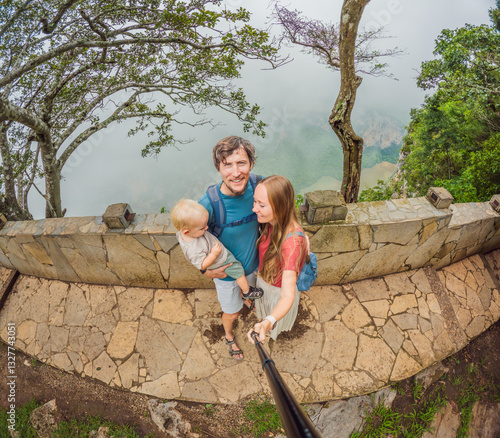 Obraz na płótnie Family exploring Sumidero Canyon, Mexico. Parents and their young son on an adventurous journey through stunning cliffs, lush landscapes, and river scenery. Concept of family travel, eco-tourism, and w salonie