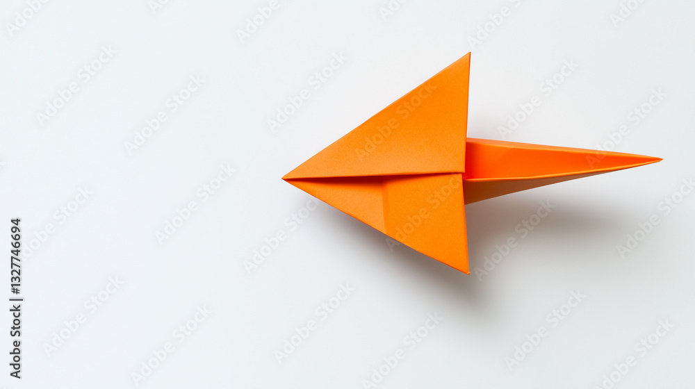 Origami orange paper arrow on white background Origami orange paper arrow on white background