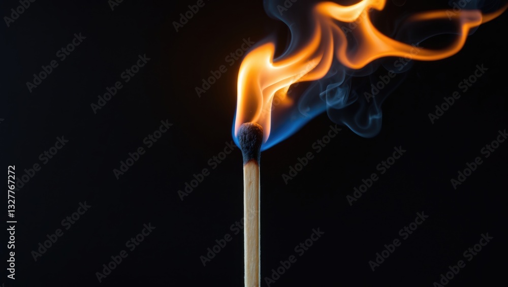 Burning match set against a black background with smoke swirling. Burning match set against a black background with smoke swirling.