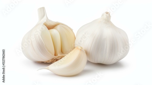 Fresh cloves of garlic, isolated on a white background, showcasing their natural texture and vibrant color.