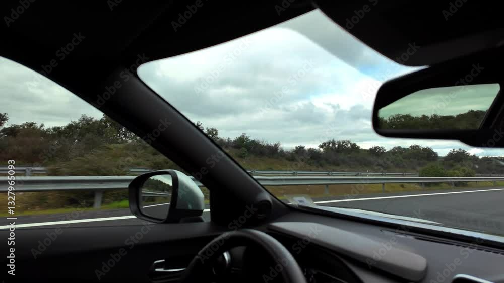 Endless road leading through scenic views from a car window Endless road leading through scenic views from a car window