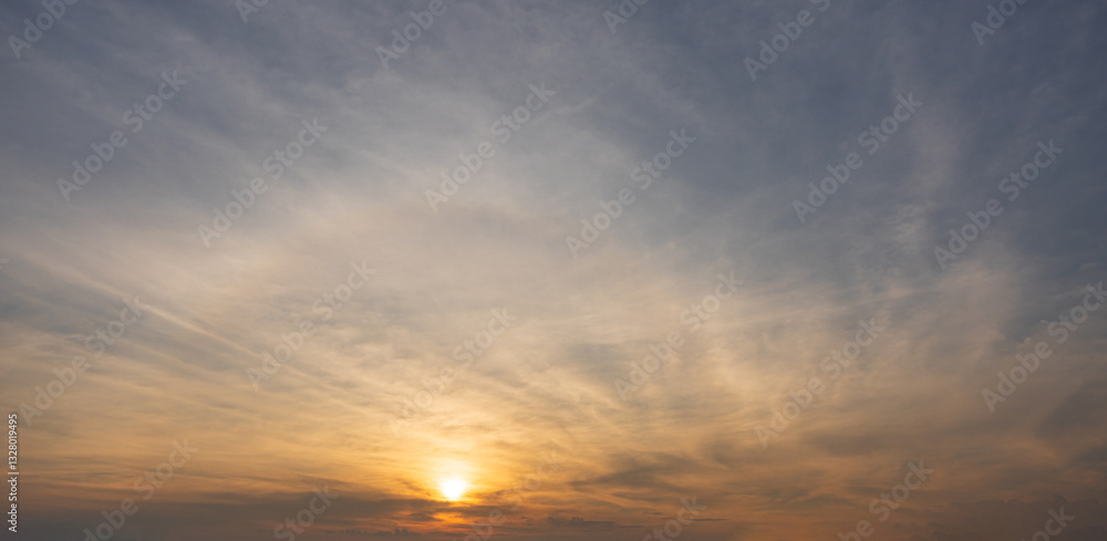 Fototapeta premium Dramatic sunrise cloud blue sky with orange sunshine