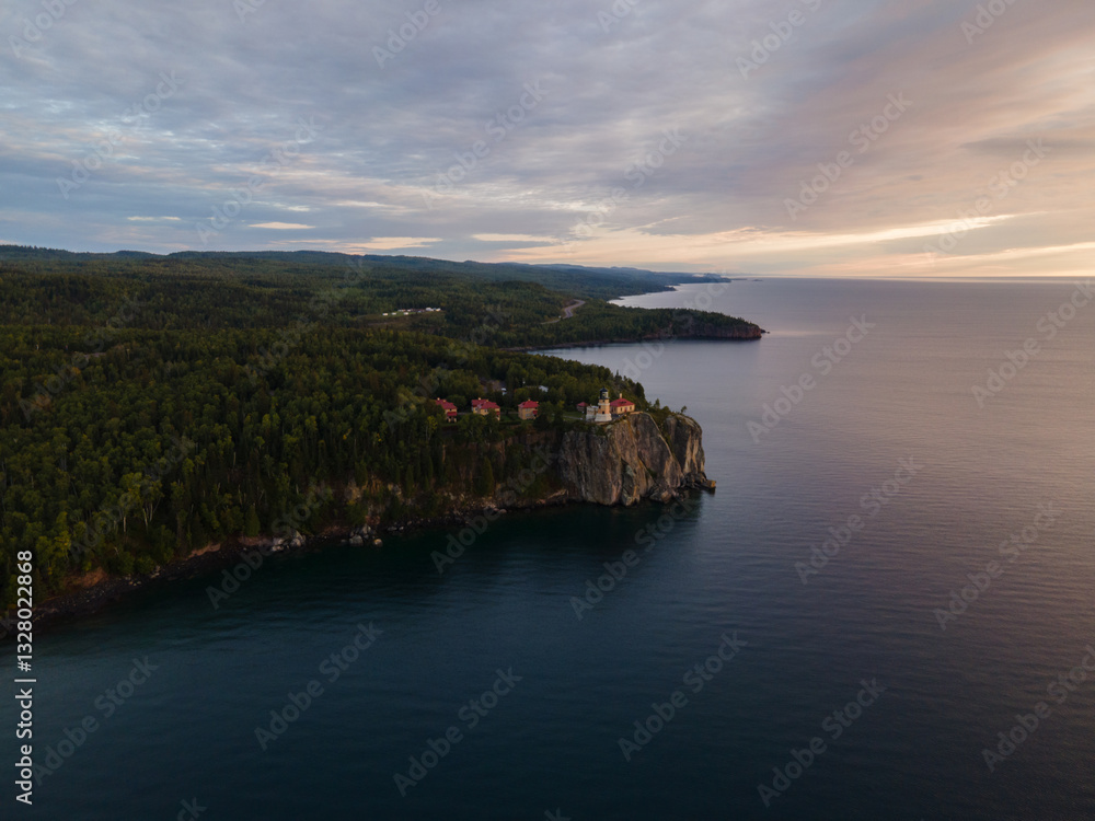 stunning aerial view of Split Rock Lighthouse at sunrise, glowing over Lake Superior’s summer shoreline. Minnesota stunning aerial view of Split Rock Lighthouse at sunrise, glowing over Lake Superior’s summer shoreline. Minnesota