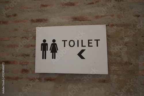 Restrooms sign with arrow