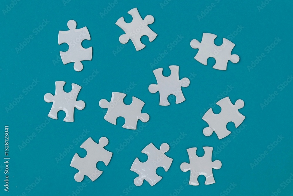 White puzzles scattered on blue background White puzzles scattered on blue background