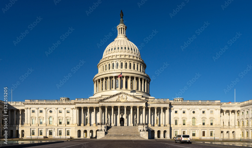 Obraz premium Capitol as a symbol of democracy in Washington, DC. The Capitol building on Capitol Hill. US government. American flag adorns the dome of the historic Capitol. The Senate. Capital of America.