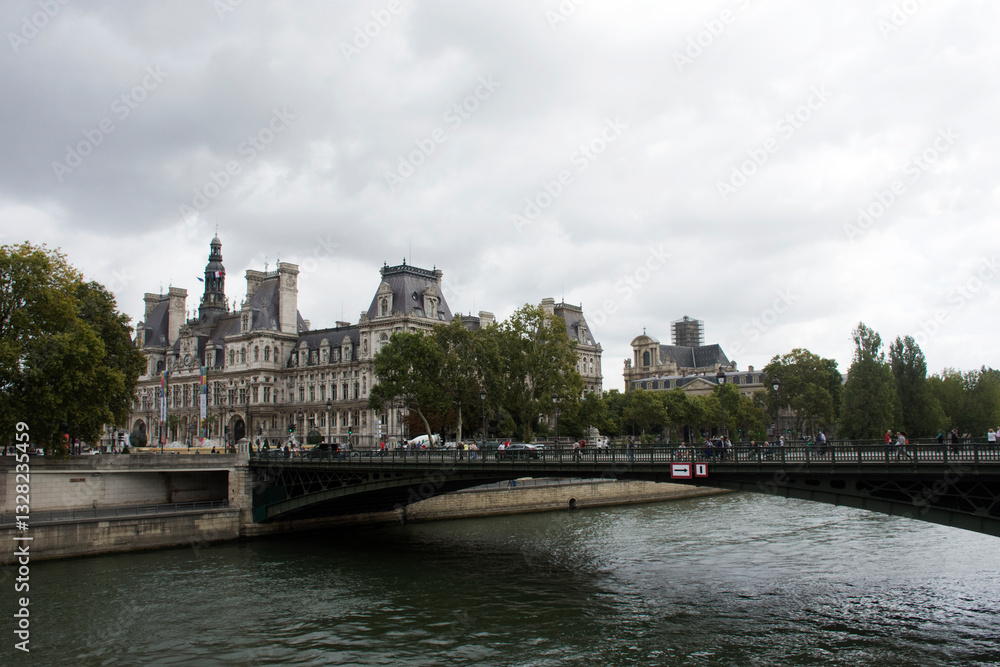 Fototapeta premium View landscape of Paris city at riverside of Seine river and Hotel de Ville with traffic road