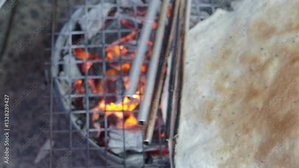 Grilling rice crackers with a charcoal stove Grilling rice crackers with a charcoal stove