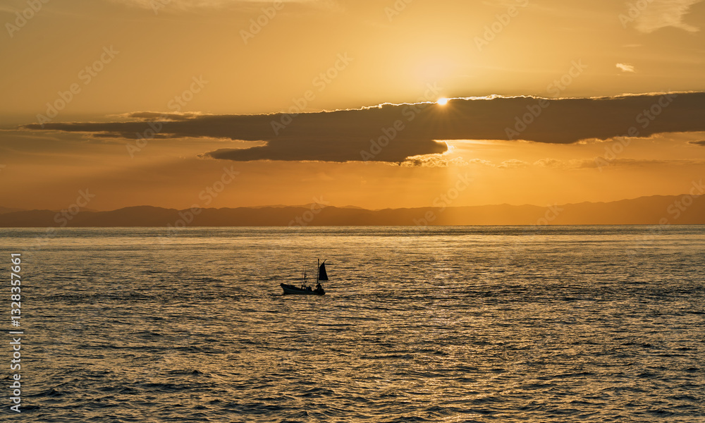 Fototapeta premium Seascape at Sunset - Calm Seas and Homeward-bound Boat