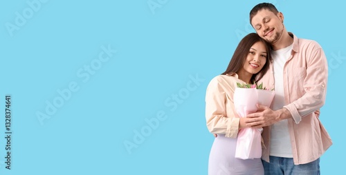 Happy young couple with bou...
