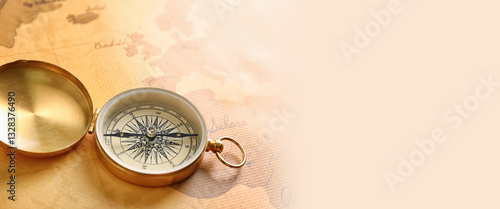 Compass on vintage world map